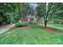 Charming brick home with lush landscaping and a circular driveway at 907 Thorn Ridge Ln, Lake Wylie, SC 29710