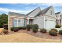 Charming home with stone and siding, a two car garage, and a well maintained yard at 9119 Gander Dr, Charlotte, NC 28277