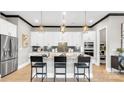 Stylish kitchen with a center island, granite countertops, pendant lighting, and stainless steel appliances at 1047 Rabbit Hill Ln, Monroe, NC 28110
