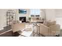Inviting living room features a fireplace, sofa, and chairs, perfect for relaxing and entertaining at 109 Noah Ln, Troutman, NC 28166