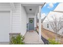 Inviting entryway featuring a gray front door adorned with a wreath and a 'Welcome' mat and sign at 112 Buoy Ln, Statesville, NC 28677