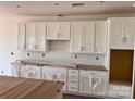 Bright kitchen featuring white cabinets, subway tile backsplash, and modern finishes at 13248 Chopin Ridge Rd, Huntersville, NC 28078