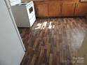 View of the kitchen flooring and white appliances at 146 Loomis St, Chester, SC 29706