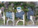 Expansive property featuring a backyard oasis with pool, manicured lawn, mature trees, and privacy at 1506 Venetian Way Dr, Waxhaw, NC 28173