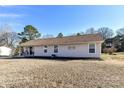 Lovely home with a well-kept lawn, complemented by a comfortable porch and manicured flowerbeds at 1511 Liberty Ave, Albemarle, NC 28001