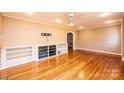 Bright living room featuring hardwood floors and a built in shelving unit at 1552 10Th Street Nw Pl, Hickory, NC 28601