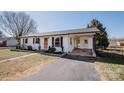 Charming single-story home with an attached carport and manicured landscaping at 3029 Wendover Nw Rd, Concord, NC 28027