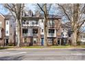 Charming townhomes feature brick and siding exteriors, fenced yards, and tree-lined street views at 3064 Selwyn Ave, Charlotte, NC 28209