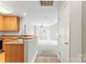 Open-concept kitchen flows into a dining and living area with lots of natural light at 6464 Park Pond Dr # 7, Charlotte, NC 28262