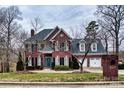 Beautiful two story brick home with symmetrical design and mature landscaping at 649 46Th Avenue Ne Dr, Hickory, NC 28601