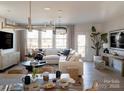 Open-concept living area with hardwood floors and modern decor at 7003 Impulse Ct, Charlotte, NC 28205