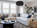 Comfortable living room with a large sectional sofa, stylish decor, and ample natural light at 7003 Impulse Ct, Charlotte, NC 28205