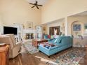 Bright, airy living room features vaulted ceilings, a cozy fireplace, and stylish furnishings at 10700 Summitt Tree Ct, Charlotte, NC 28277