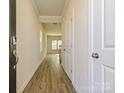 Inviting home hallway featuring wood floors leading to the rest of the house at 1105 Harry Ct, Albemarle, NC 28001