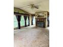 Spacious living room featuring a cozy fireplace and large windows at 13080 Philadelphia Church Rd, Oakboro, NC 28129