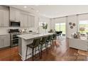 Open-concept kitchen with a large island, stainless steel appliances, and hardwood floors at 145 Shepherds Landing Dr, Mooresville, NC 28115