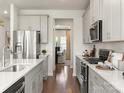 Stylish kitchen featuring stainless steel appliances, gray cabinetry, and ample counter space at 145 Shepherds Landing Dr, Mooresville, NC 28115