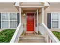 Inviting front porch featuring a vibrant red door and a welcoming entrance area at 1461 Flintwood Dr, Rock Hill, SC 29732