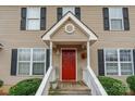Close-up of the entryway with a red door and covered porch at 1465 Flintwood Dr, Rock Hill, SC 29732