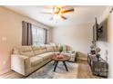 Bright living area with a large sectional couch, ceiling fan, and modern decor at 1469 Flintwood Dr, Rock Hill, SC 29732
