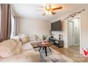 Cozy living room with a comfortable sectional sofa, ceiling fan, and mounted television at 1469 Flintwood Dr, Rock Hill, SC 29732