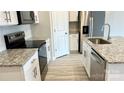 Well-appointed kitchen featuring granite countertops, stainless steel appliances, and ample storage space at 1760 Braemar Village Dr, Monroe, NC 28110