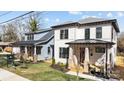 Attractive home exterior featuring a covered porch, well-maintained landscaping, and modern design at 1828 Haines St, Charlotte, NC 28216