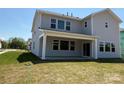 Exterior of a two-story home featuring a covered patio at 2204 Camber Dr # Cwo0076, Gastonia, NC 28054