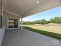 Covered patio offers outdoor living space and scenic backyard views at 2204 Camber Dr # Cwo0076, Gastonia, NC 28054