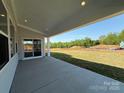 Covered patio overlooking a spacious backyard at 2204 Camber Dr # Cwo0076, Gastonia, NC 28054
