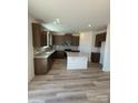 Modern kitchen featuring granite countertops, stainless steel appliances, and a functional center island at 334 Knotty Wood Dr # 68, Monroe, NC 28110