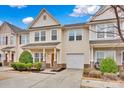 Inviting townhome with a well-maintained lawn, garage, and a cozy front porch at 4708 Tradd Cir, Monroe, NC 28110