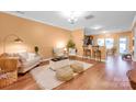 Inviting living room featuring hardwood floors, neutral decor, and a cozy seating area at 4708 Tradd Cir, Monroe, NC 28110