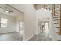 Spacious hallway leads to various rooms, showcasing modern gray flooring and neutral wall colors at 5125 Isaac Dr, Charlotte, NC 28216