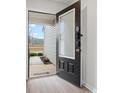 An open front door showcasing an electronic keypad and the view of the front yard at 709 Daniel Ln, Richburg, SC 29729