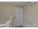 Exterior shot of the front door with unit number and security features, providing a safe entry at 1036 Plaza Walk Dr, Charlotte, NC 28215