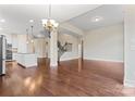 Spacious open-concept living area with hardwood floors, staircase, and ample natural light at 11604 Bradford Park Dr, Davidson, NC 28036