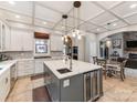 An open kitchen with marble countertops, stainless appliances, kitchen island, and eat in area at 123 Yellow Jacket Cir, Mooresville, NC 28117