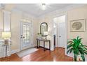 Elegant foyer with hardwood floors, decorative door, and stylish accents at 138 Buffalo Creek Dr, Statesville, NC 28677