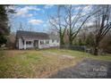 Charming one-story home featuring classic architecture, inviting curb appeal and a well-maintained front yard at 1863 Hilltop Cir, Gastonia, NC 28054