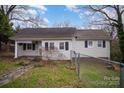Charming one-story home featuring classic architecture, inviting curb appeal and a well-maintained front yard at 1863 Hilltop Cir, Gastonia, NC 28054