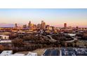 Expansive city skyline view with highways, trees, and building tops in foreground at 2306 Elizabeth Mill Pl, Charlotte, NC 28208