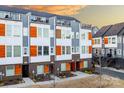 Modern townhome exterior showcasing a brick facade, gray siding, and upper-level patios at 2306 Elizabeth Mill Pl, Charlotte, NC 28208