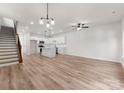 Spacious open floor plan with white walls, lots of natural light, wood flooring and a staircase at 2825 New Pineola Rd # 7A, Charlotte, NC 28208