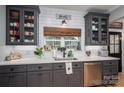 Well-lit kitchen with stainless steel appliances, quartz countertops, and farmhouse-style accents at 329 Wintergreen Ct, Kings Mountain, NC 28086