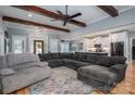 Spacious living room with hardwood floors, exposed beams, and a comfortable sectional sofa, great for entertaining at 329 Wintergreen Ct, Kings Mountain, NC 28086