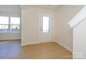 Bright entryway featuring hardwood floors, neutral walls, and lots of natural light at 3928 Craig Ave, Charlotte, NC 28211