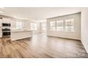 Bright and airy living room featuring hardwood floors and multiple windows for plenty of natural light at 5944 Oak Branch Cir, Maiden, NC 28650