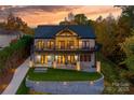 Beautiful brick home featuring outdoor living spaces and manicured lawn at 6233 Riviera Run Estates Dr, Hickory, NC 28601