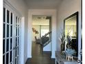 Elegant foyer with hardwood floors, a staircase, and a view into the living room at 7711 Bainbridge Rd, Sherrills Ford, NC 28673